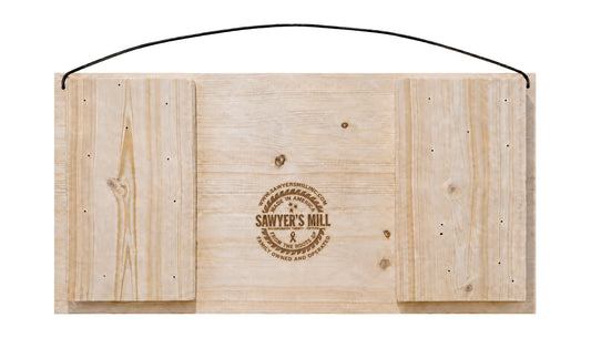 Back of Sawyer's Mill 7 x 14 pine sign showing wood construction, branding, and attached wire hanger.