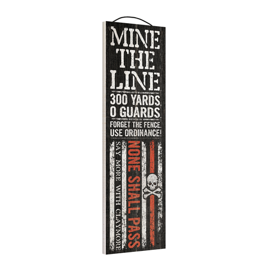 Angled view of the Mine the Line, Forget the Fence 5 x 16 wood sign, showing the board thickness and wire hanger