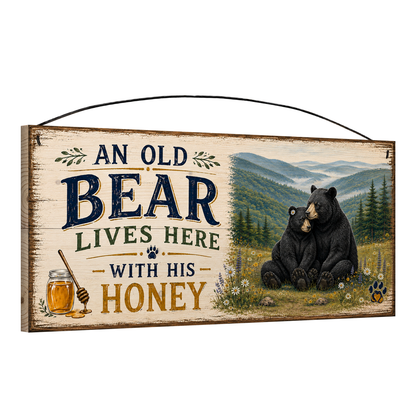 Angled view of the Old Bear & His Honey black bear meadow 7 × 16 pine sign showing its thickness and end grain