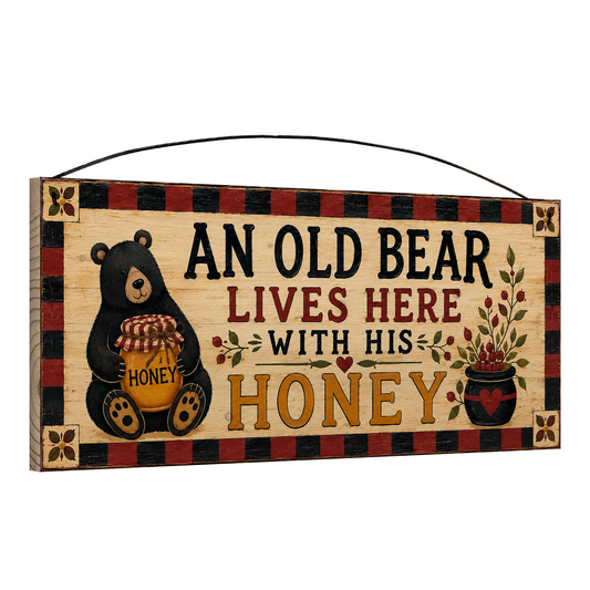 Angled view of the Old Bear and His Honey Jar 7 x 16 pine wood sign showing the board edge and hanging wire