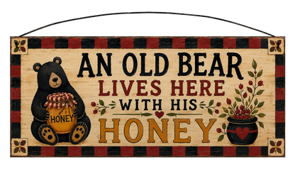 An Old Bear Lives Here With His Honey 7x16 pine sign with black bear, honey jar, berry arrangement, and buffalo plaid border