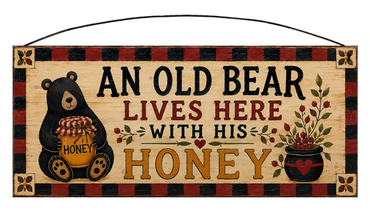 An Old Bear Lives Here With His Honey 7x16 pine sign with black bear, honey jar, berry arrangement, and buffalo plaid border