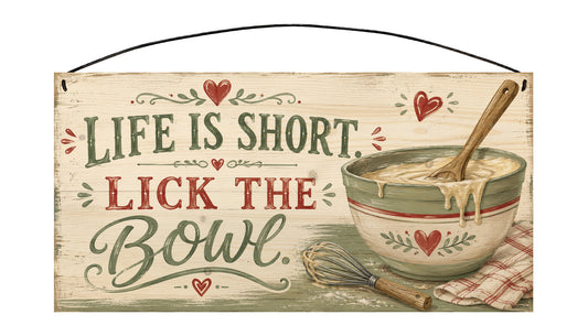 Sawyer's Mill 7 x 14 pine sign reading Life is short. Lick the bowl. with vintage mixing bowl, wooden spoon, whisk, and red heart accents.
