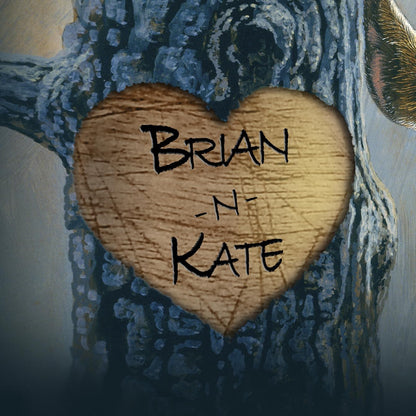 This is a closeup view of the heart in the tree. A playful raccoon hangs from a tree limb, next to a heart carved in the tree trunk that can be customized with any two names.