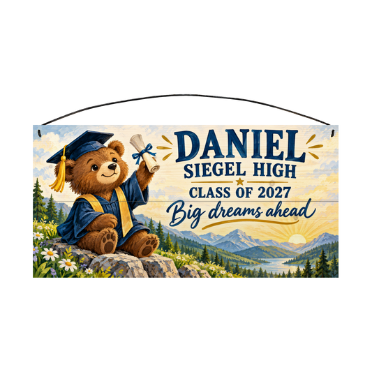 Personalized Big Dreams Ahead graduation wood sign, 7 x 14 in — a teddy bear in a navy cap and gown holding up a diploma on a mountain overlook at sunrise