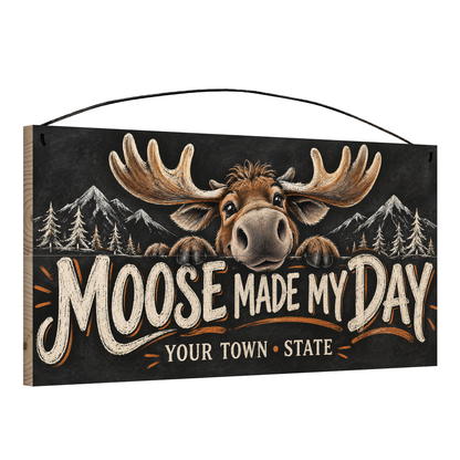 Angled view of the personalized Moose Made My Day 7 x 14 in pine wood sign, showing the board thickness and wire hanger