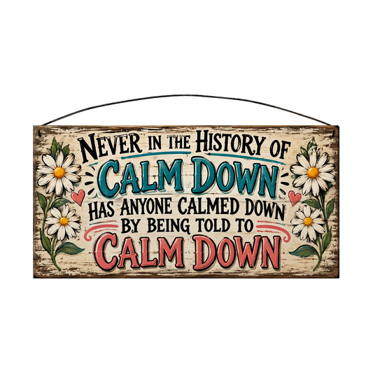 Never in the History of Calm Down wood sign, 7 x 14 in, black, teal and coral lettering between white daisies, whitewashed pine