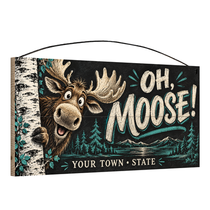 Angled view of the personalized Oh, Moose! 7 x 14 in pine wood sign, showing the board thickness and wire hanger