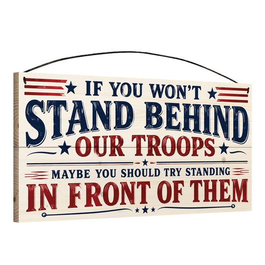 Angled view of the Stand Behind Our Troops patriotic 7 x 14 pine wood sign showing the board edge and hanging wire