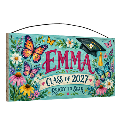 Angled view of the personalized Ready to Soar graduation 7 x 14 in pine wood sign, showing the board thickness and wire hanger