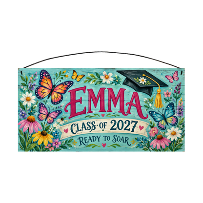 Personalized Ready to Soar graduation wood sign, 7 x 14 in — bright monarch and blue butterflies with wildflowers and a graduation cap, on a turquoise board with bold pink name lettering