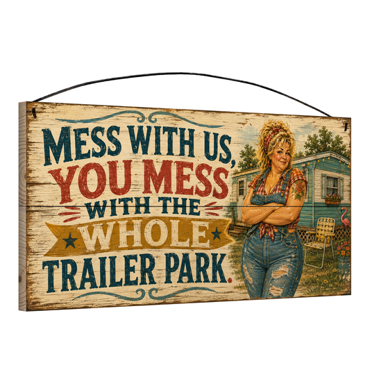 Angled view of the Mess With Us You Mess With the Whole Trailer Park retro pin-up 7 x 14 pine wood sign showing the board edge and hanging wire