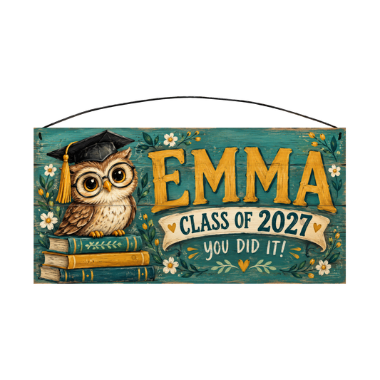 Personalized You Did It! graduation wood sign, 7 x 14 in — a wise little owl in a graduation cap and round glasses perched on a stack of books, on a teal painted board with yellow name lettering and a cream banner