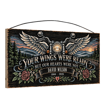 Angled view of the personalized Your Wings Were Ready motorcycle memorial 7 x 14 in pine wood sign, sample name David Wilson 1966 - 2026 in the banner