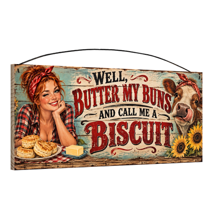 Angled view of the Butter My Buns cow and sunflowers 7 x 16 pine wood sign showing the board edge and hanging wire