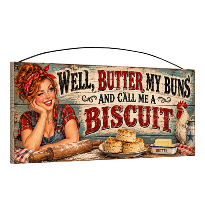 Angled view of the Butter My Buns rolling pin 7 x 16 pine wood sign showing the board edge and hanging wire