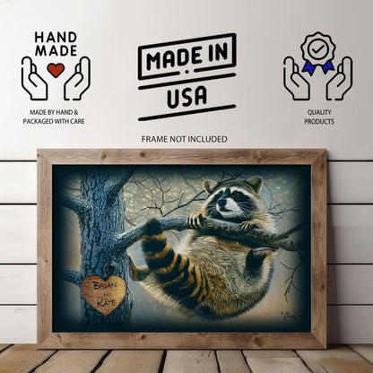 Here you see a cute raccoon hanging playfully from a tree branch, with a heart carved into the tree trunk that has two names inside.