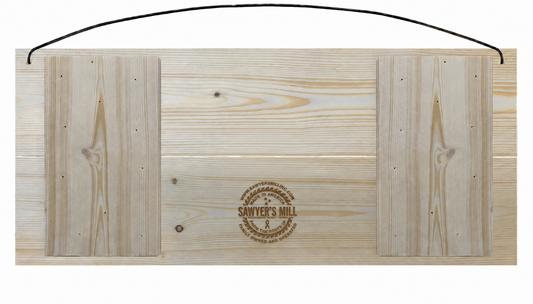Back of Sawyer’s Mill 7x16 pine sign with small centered wood-burned logo on lower board