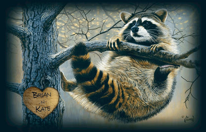 This print shows a raccoon gripping a tree limb, and carved into the tree is a big heart with two names written inside it.