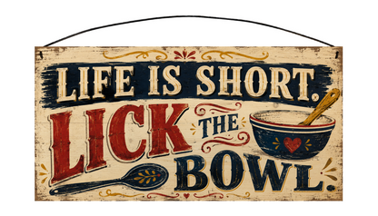 Sawyer's Mill 7 × 14 pine sign reading Life is short. Lick the bowl. with a vintage mixing bowl, wooden spoon, navy, red, and golden accents.