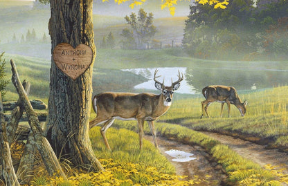 Personalized whitetail deer print featuring a buck and doe in a forest with a carved heart on a tree displaying two custom names – rustic wildlife wall art.