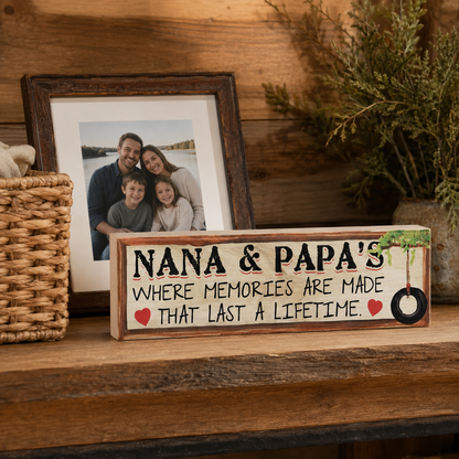 Rustic Nana and Papa family memory sign displayed on a cabin console beside a woven basket and framed photo.