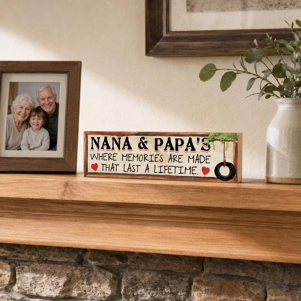 Nana and Papa solid maple wood sign displayed on a warm wood mantel beside a family photo and ceramic vase.