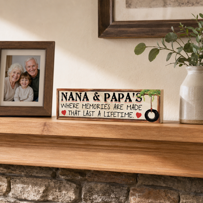 Nana and Papa solid maple wood sign displayed on a warm wood mantel beside a family photo and ceramic vase.