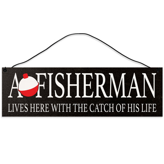 Sawyer's Mill - A Fisherman Lives Here with the Catch of his Life. Wood Sign for Home or Office. Measures 3x10 inches.